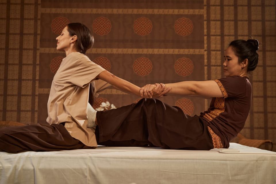 Full-body stretching during a Thai massage session